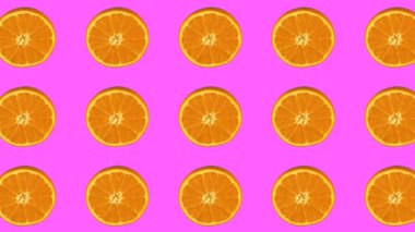Turuncu desen, pembe arka planda meyve animasyonu. Döngülü canlandırma