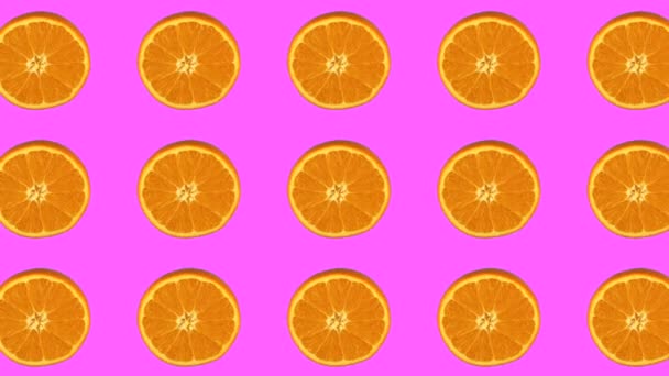 Padrão laranja, animação de frutas no fundo cor-de-rosa. Animação em loop — Vídeo de Stock