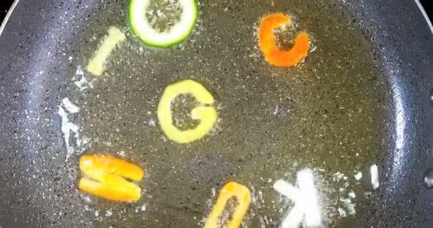 Stir-frying mixed alphabet letters, word cooking — Stock Video