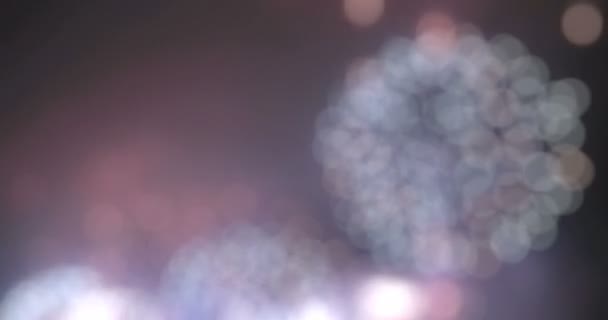 Blurred fairy lights from fireworks background. — Stock Video