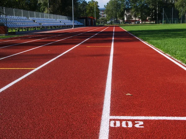 Racetrack vermelho no estádio — Fotografia de Stock