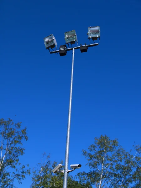 Stadium light against blue sky — Stock Photo, Image