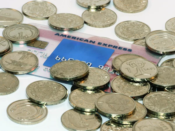 Bunch of coins with credit card — Stock Photo, Image