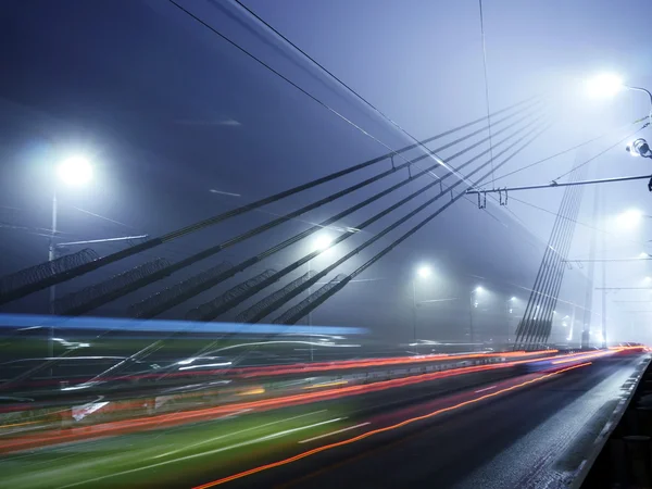 Vansu most světla v mlze, Riga — Stock fotografie