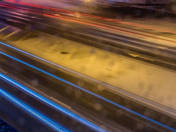 Car light at night on ice road in snow winter — Stock Photo, Image