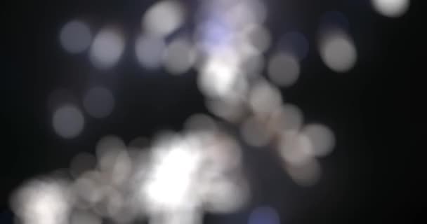 Blurred fairy lights from fireworks background. — Stock Video
