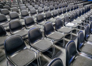 Many empty chairs in conference room clipart