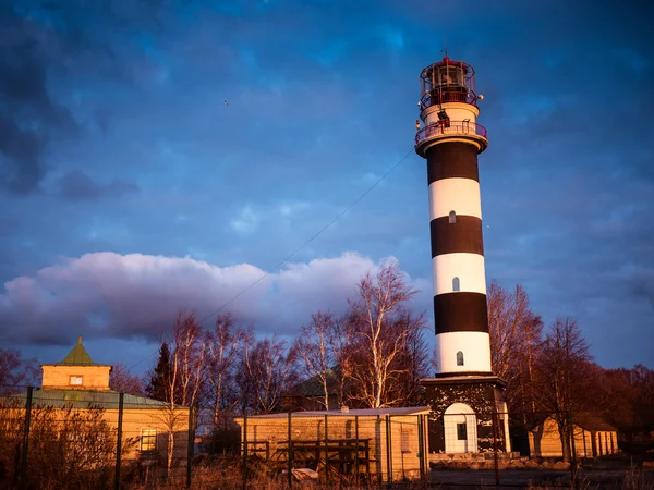 Ocean sunrise with lighthouse — Stock Photo, Image