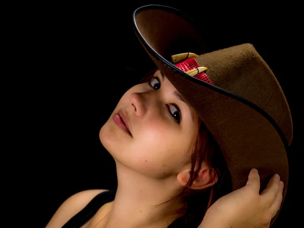 Woman with a cowgirl hat on her head — Stock Photo, Image