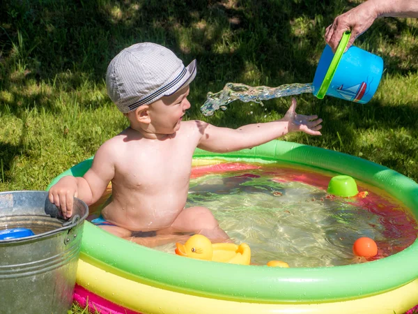 Little baby boy playing in swimming pool Royalty Free Stock Photos