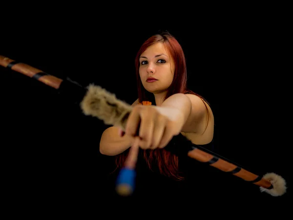 Beautiful archery woman aiming, black background — Stock Photo, Image