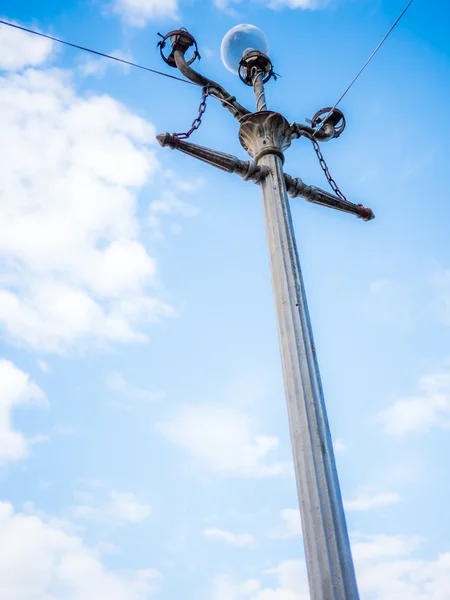 Electric pole on blue sky background — Stock Photo, Image