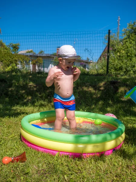 Little baby boy playing in swimming pool Stock Image