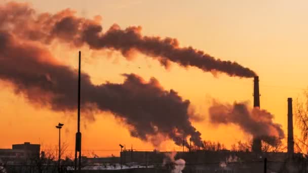 Smoke from factory chimneys over grey sky and clouds. — Stock Video