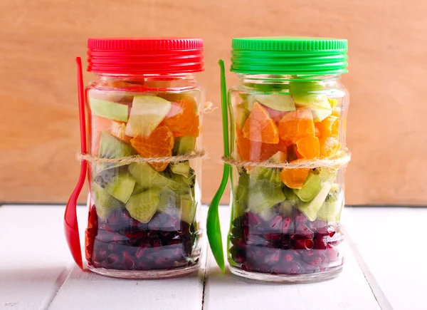 Fruits layered in glass jars — Stock Photo, Image