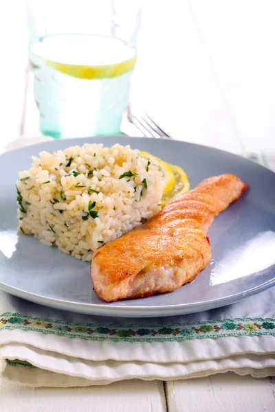 Fried piece of salmon and rice — Stock Photo, Image