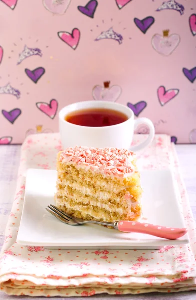 Slice of layered cake with topping — Stock Photo, Image