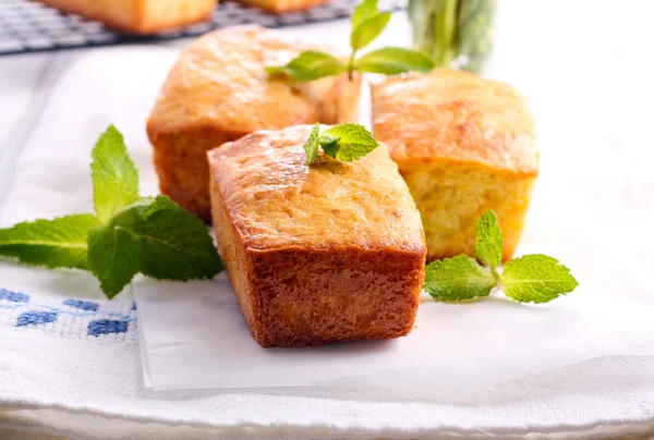 Mini loaf cakes with mint decoration — Stock Photo, Image