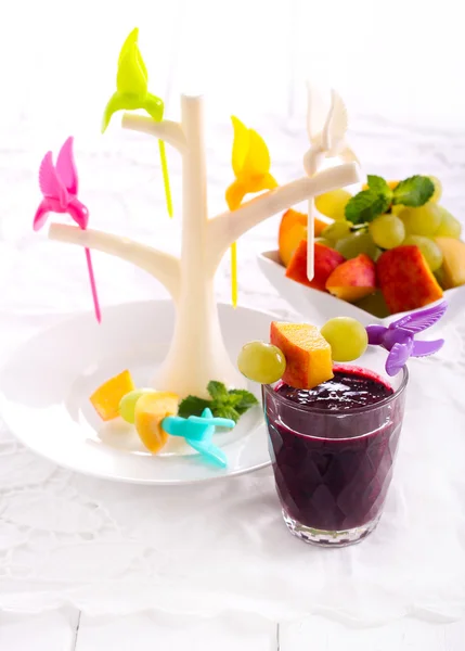 Berry smothie and fruits on sticks — Stock Photo, Image