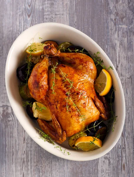 Thyme and lemon roast chicken in a tin