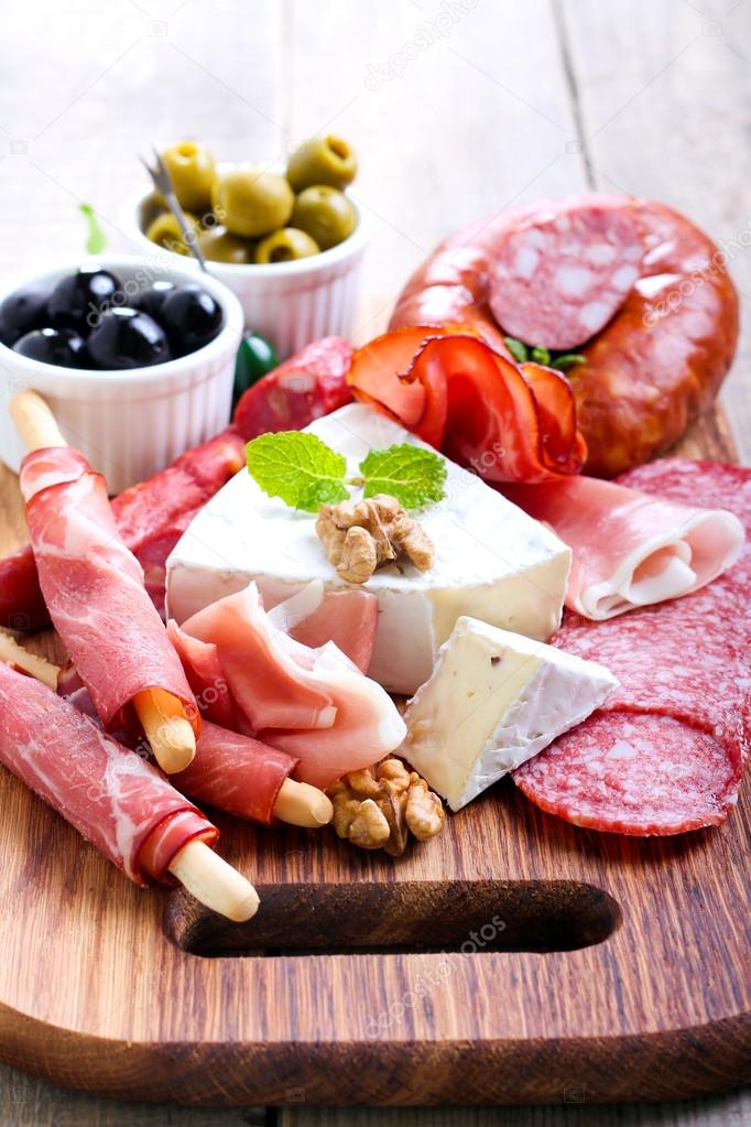 Catering platter with different meat and cheese — Stock Photo