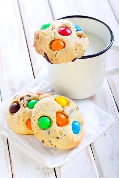 Cookies with colorful button shaped candies — Stock Photo, Image