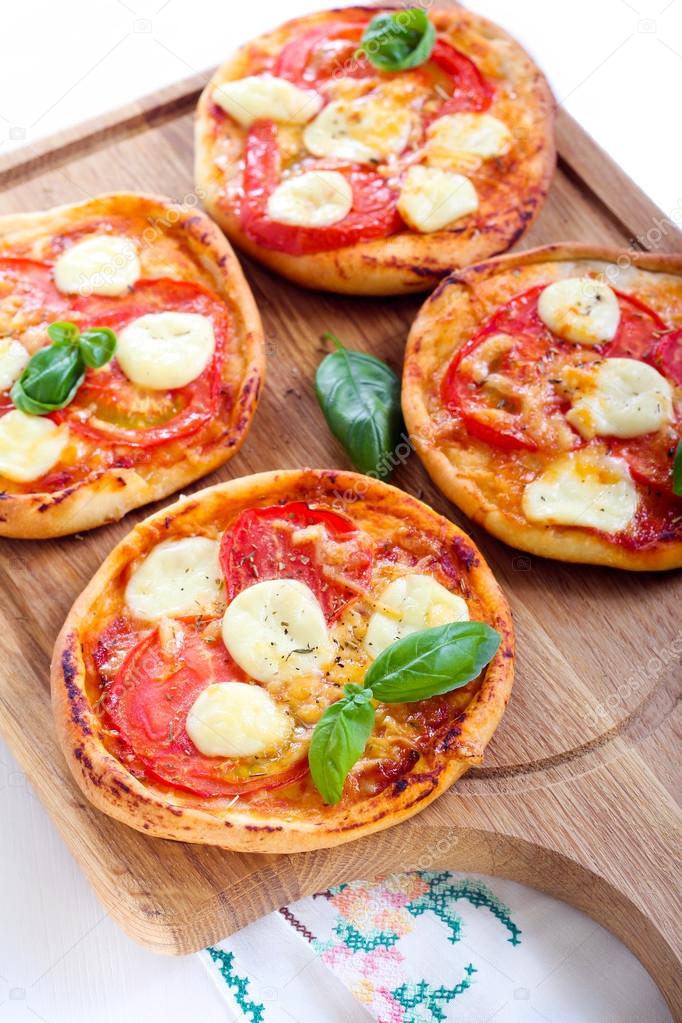 Tomato and mozzarella mini pizzas