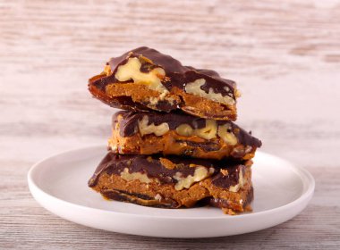 Healthy homemade bars made of date, peanut butter nuts and chocolate