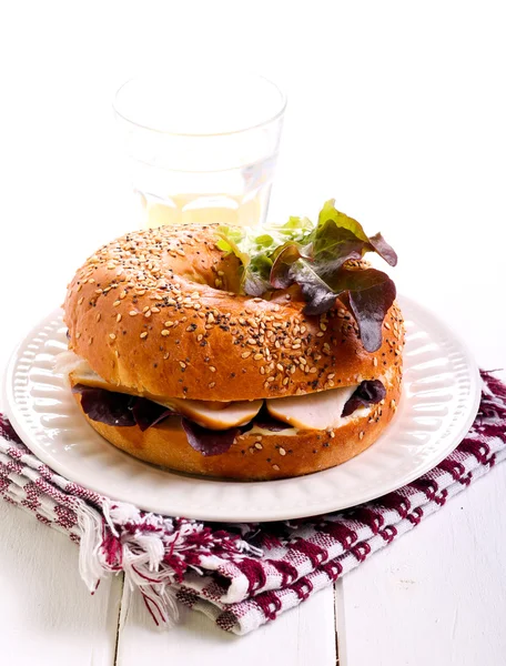 Cheese and smoked chicken breast bagel — Stock Photo, Image