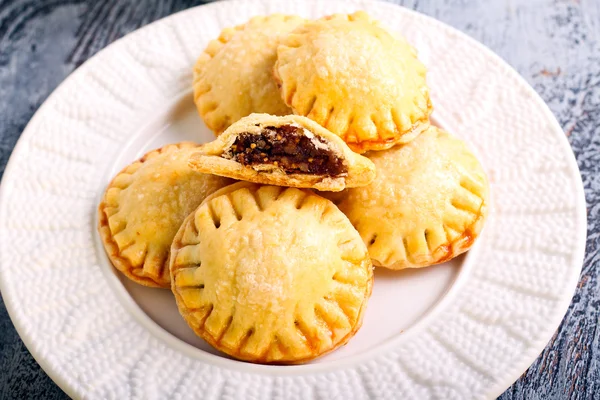 Bite size round pastries on plate — Stock Photo, Image