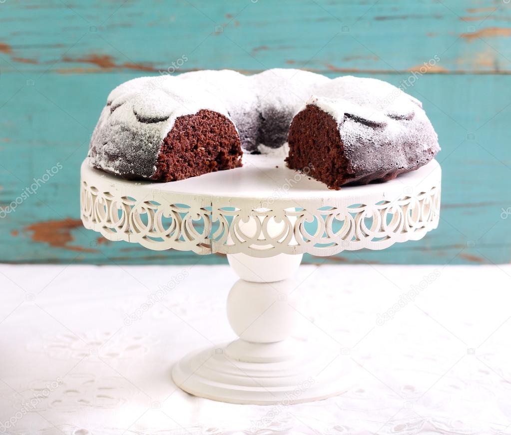 Chocolate ring cake coated with icing sugar