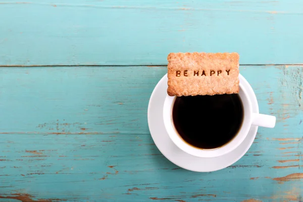 Cup of coffee and biscuit with be happy