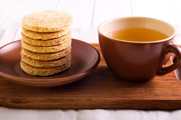 Coconut biscuits and cup of tea — Stock Photo, Image