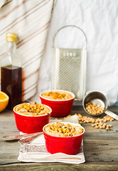 Vegetable casserole with mushrooms, chickpeas and nuts in a red — Stock Photo, Image