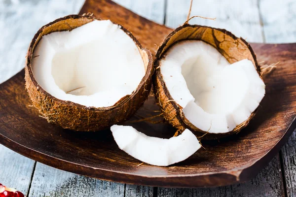 Fresh coconuts in the shell on a blue background — Stock Photo, Image