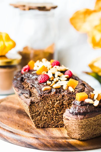 Chocolate cake with pumpkin, nuts and frosting, autumn baked — Stock Photo, Image