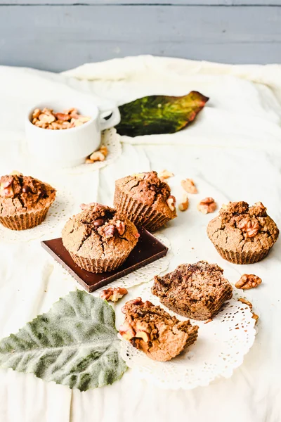 Break chocolate muffins with walnuts, vegan baking, bright autum — Stock Photo, Image