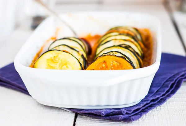 Hot ratatouille in a baking dish on a white background — Stock Photo, Image