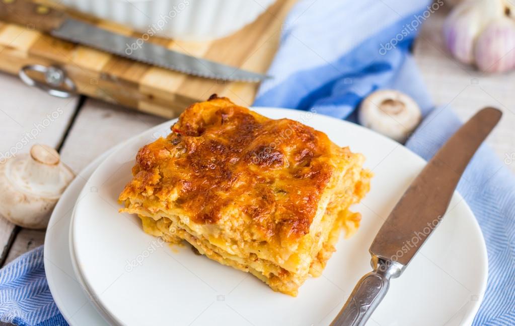 piece of meat lasagna with mushrooms, Italian cuisine 