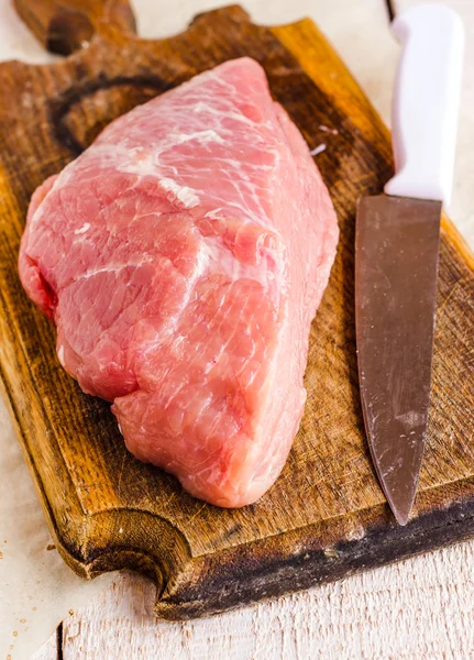 Raw meat on a cutting board — Stock Photo, Image