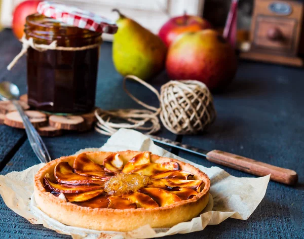 apple tart on a sand base with pear jam and caramel