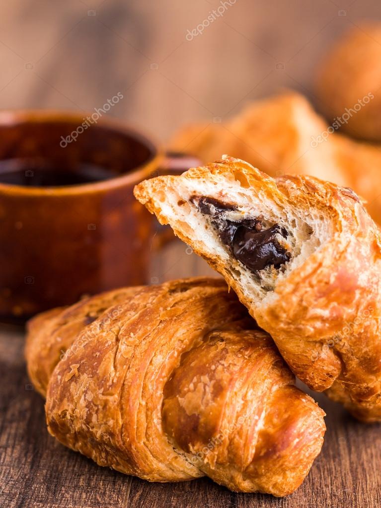 Bite Chocolate Croissant With A Cup Of Coffee French Baking On Wooden Board Photo By Haarmony Bite Chocolate Croissant With A Cup Of Coffee French Baking On Wooden Board Photo By Haarmony