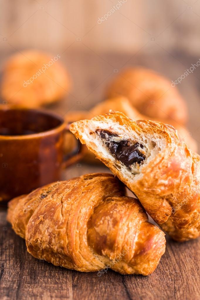 Bite Chocolate Croissant With A Cup Of Coffee French Baking On Wooden Board Photo By Haarmony Bite Chocolate Croissant With A Cup Of Coffee French Baking On Wooden Board Photo By Haarmony