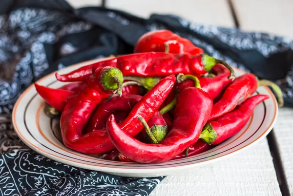 Whole chili pepper in the plate — Stock Photo, Image