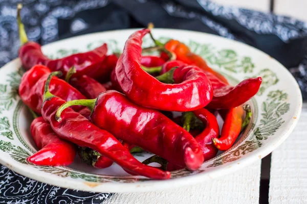 Whole chili pepper in the plate — Stock Photo, Image