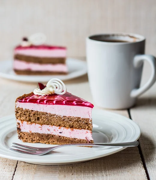 Piece of cake with a chocolate biscuit, berry mousse and jelly — Stock Photo, Image