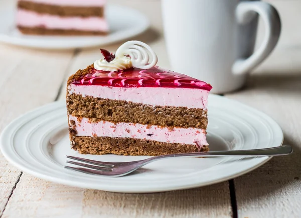 Piece of cake with a chocolate biscuit, berry mousse and jelly — Stock Photo, Image