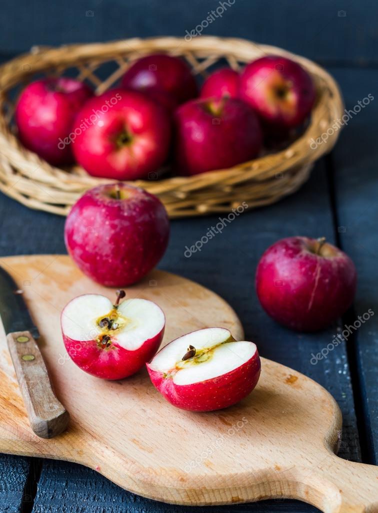 Cut in half fresh red apples on a wooden board, fruits Stock Photo by ©haarmony 67824523