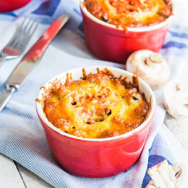 Baked mushroom julienne potatoes and tomato with cheese, lunch