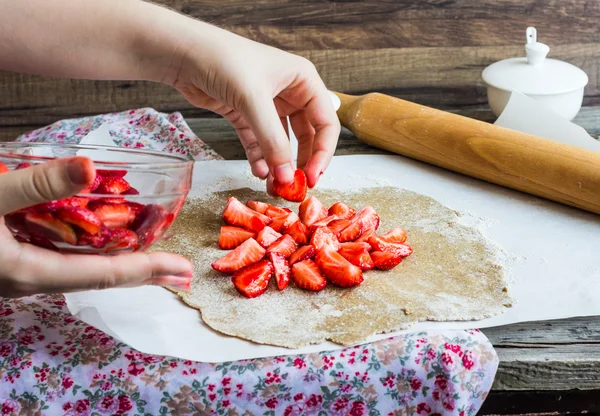 cooking processes biscuit with fresh strawberries, vegan dessert